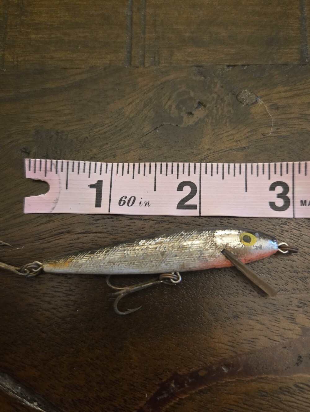 Rebel Minnow Floater fishing lure with a silver and black finish